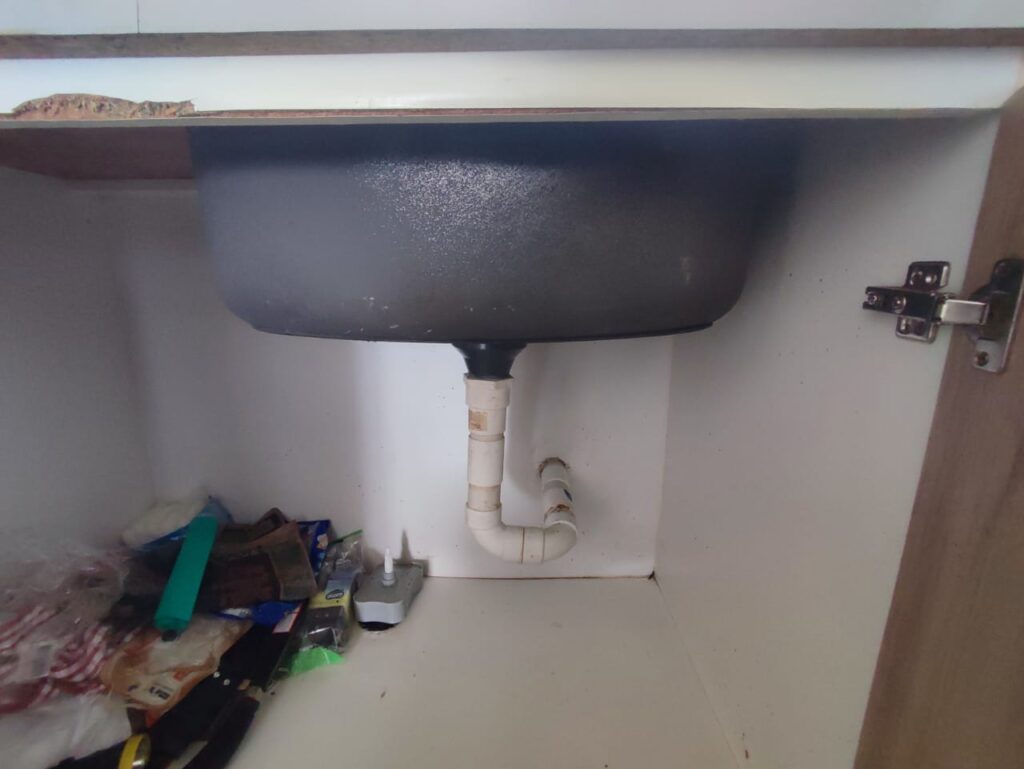 Plumber Fixing Clogged Kitchen Sink in Puchong